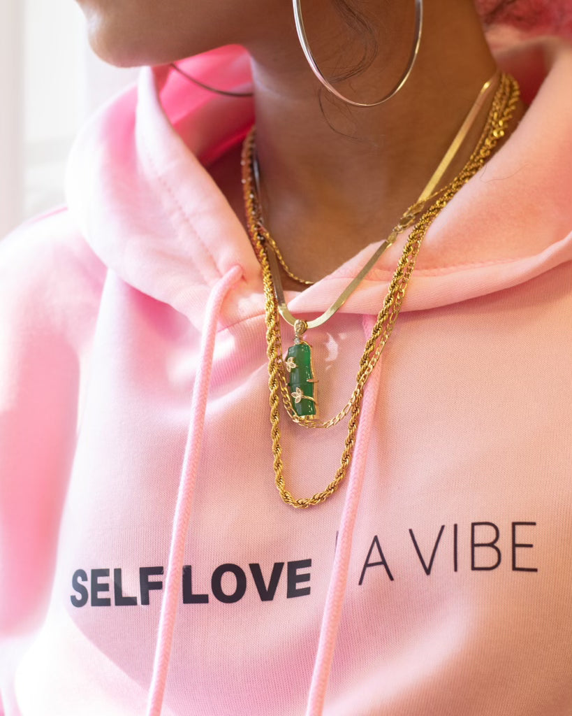 gold rope chain over pink self-love sweatshirt